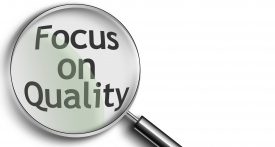 Magnifying Glass created in photoshop with the words focus on quality